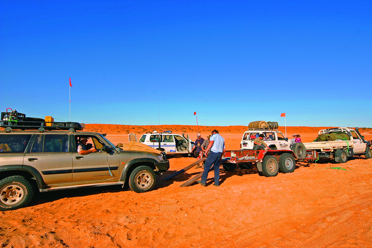 4WD in the desert being helped through an emergency