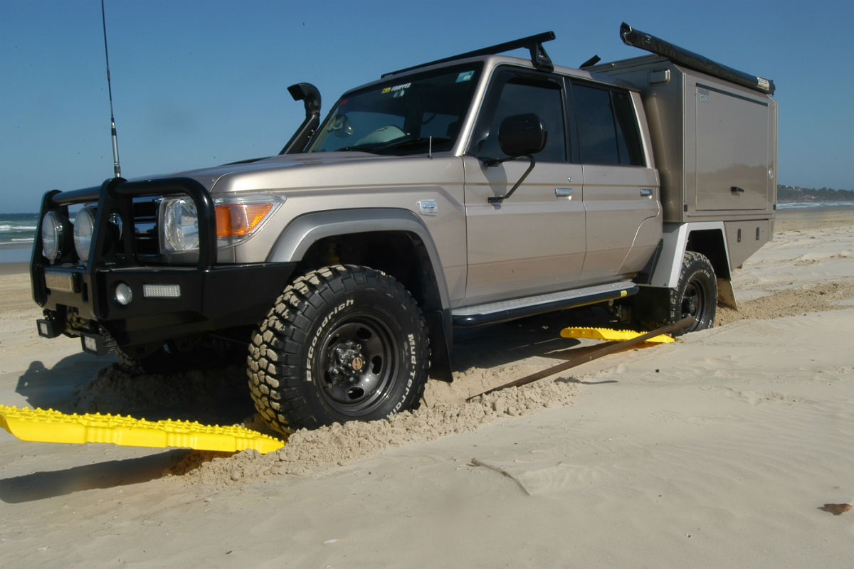 4WD on sand ladders to get through the sand on the beach