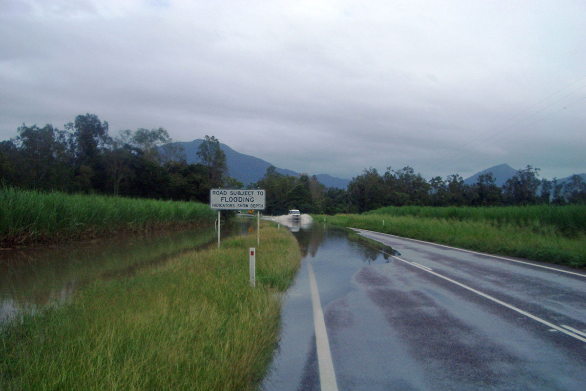 Road subject to flooding, on a wet day