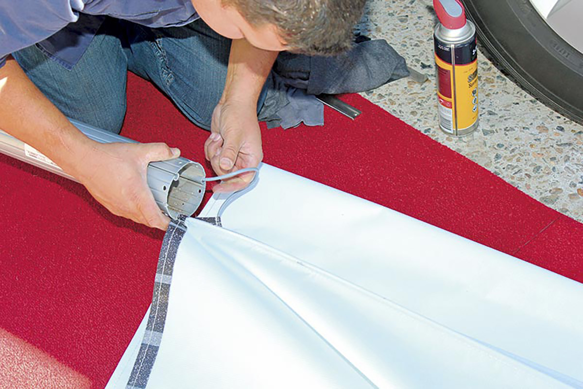 Sliding-the-splines-into-the-caravan-awning-roll