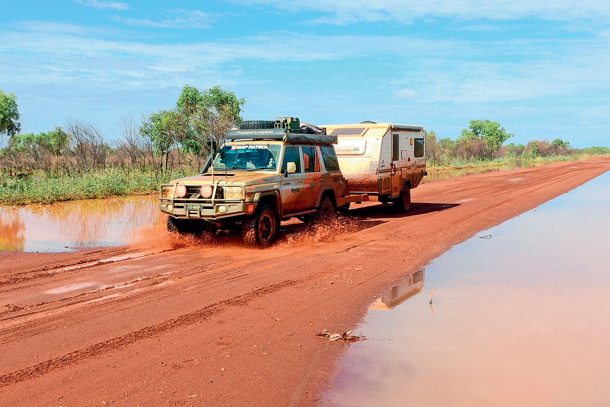 4WD-and-towing-camper-trailer-on-wet-Tanami-Rd